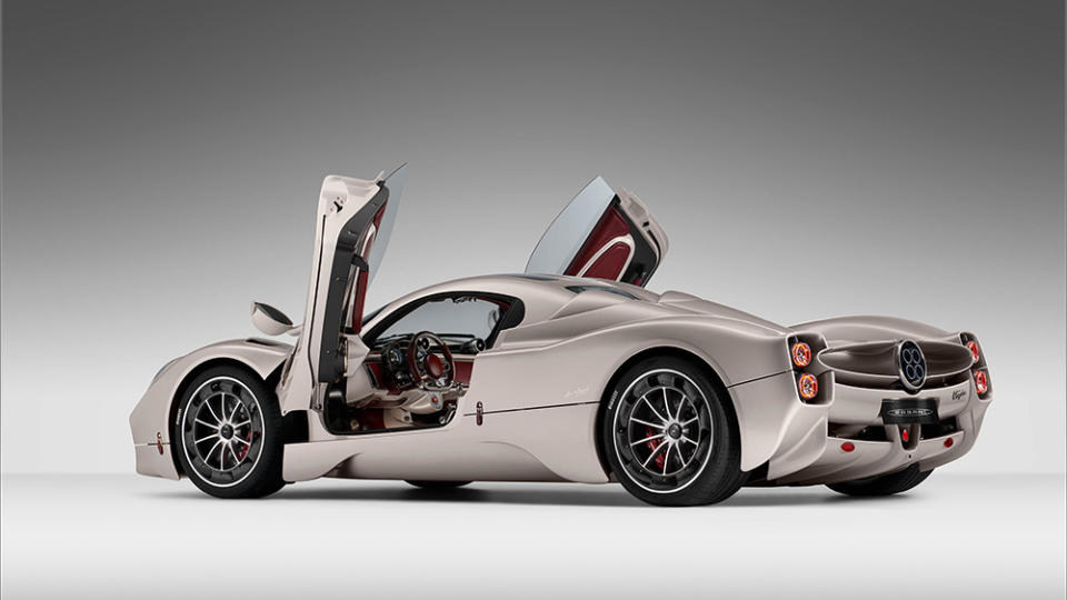 A rear 3/4 view of the Pagani Utopia with its doors open
