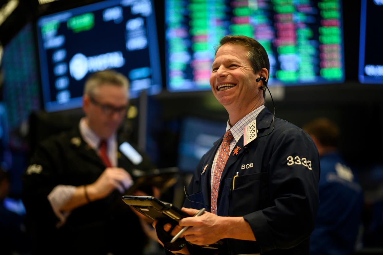 A trader laughs ahead of the closing bell on the floor of the New York Stock Exchange (NYSE) in New York City. Photo: Johannes Eisele/AFP/Getty Images