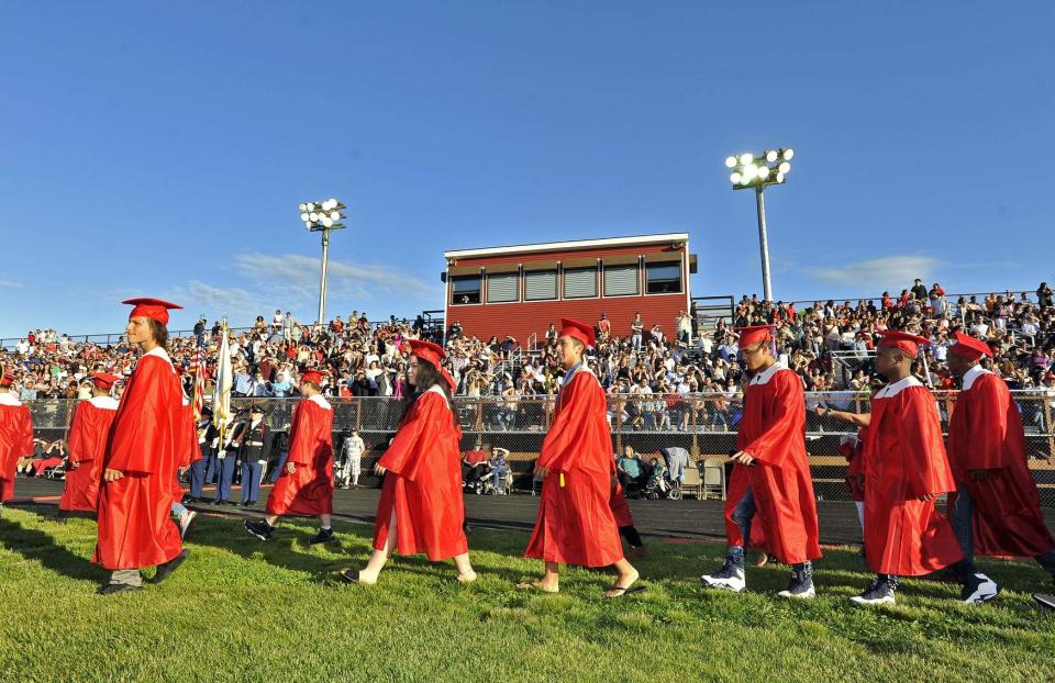 In this file photo, New Bedford HIgh School students prepare to graduate at the 2021 Commencement ceremony.