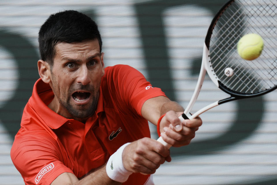 Serbia's Novak Djokovic returns the ball to Slovenia's Aljaz Bedene during their third round match of the French Open tennis tournament at the Roland Garros stadium Friday, May 27, 2022 in Paris. (AP Photo/Thibault Camus)