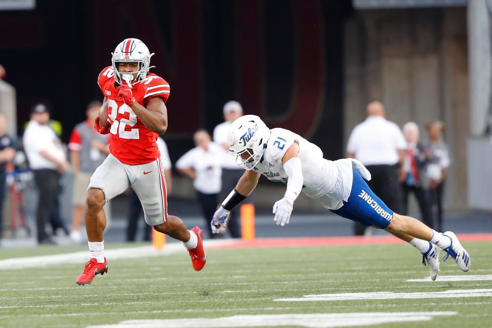 Ohio State running back TreVeyon Henderson ran for 270 yards, a new Buckeyes freshman record, against Tulsa.