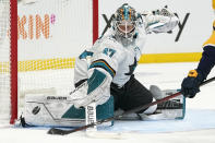 San Jose Sharks goaltender James Reimer blocks a shot against the Nashville Predators in the second period of an NHL hockey game Tuesday, Oct. 26, 2021, in Nashville, Tenn. (AP Photo/Mark Humphrey)