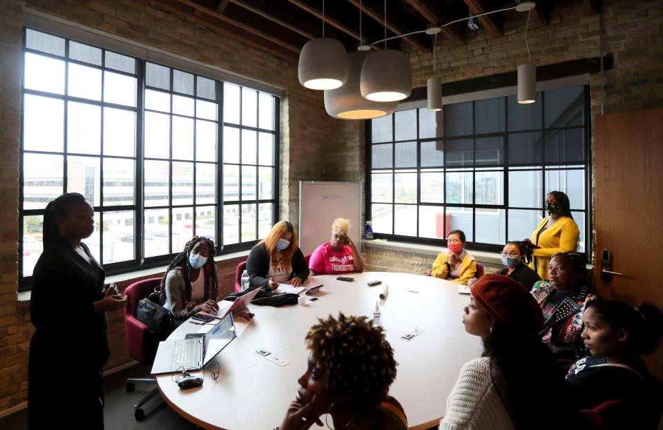 Various care coordinators gather around the table to listen to Bria Grant of Unite WI who hosted a prenatal care coordination training Tuesday, Oct. 5, 2021 at 1433 N. Water Street (Suite 400) in Milwaukee.