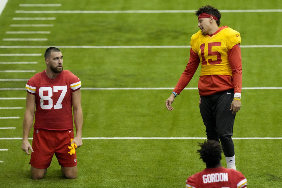 Kansas City Chiefs tight end Travis Kelce (87) and quarterback Patrick Mahomes (15) talk during an NFL football workout Wednesday, Jan. 25, 2023, in Kansas City, Mo. The Chiefs are scheduled to play the Cincinnati Bengals Sunday in the AFC championship game. (AP Photo/Charlie Riedel)