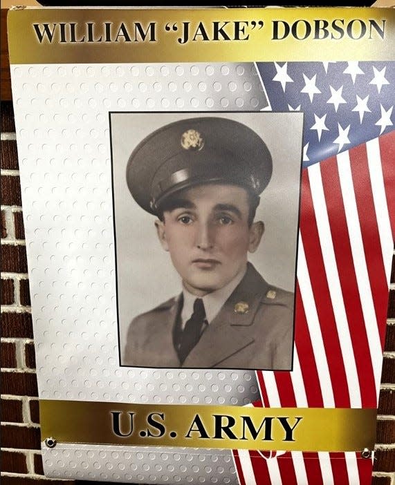 A military banner honoring William "Jake" Dobson who served in the U.S. Army during World War II. There are 40 such banners hanging this Memorial Day weekend on posts in Warsaw along with others across Coshocton County.