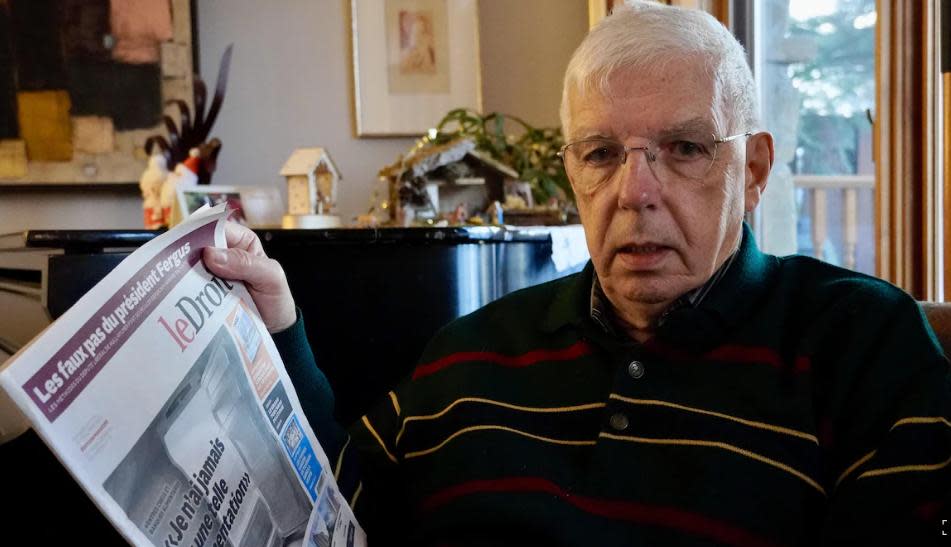 Pierre Bergeron, a retired editor at Le Droit, holds a copy of the Ottawa-Gatineau newspaper. The French-language paper published its final print edition on Saturday and is now available exclusively online. (Emilien Juteau/Radio-Canada - image credit)