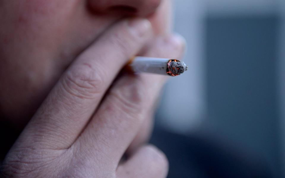 A man smoking a cigarette - Jonathan Brady /PA