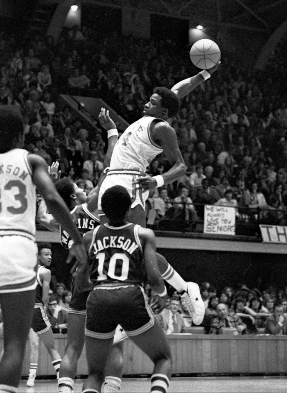 NC State’s David Thompson soars through the air during his final home game in Reynolds Coliseum against UNC-Charlotte on March 2, 1975.