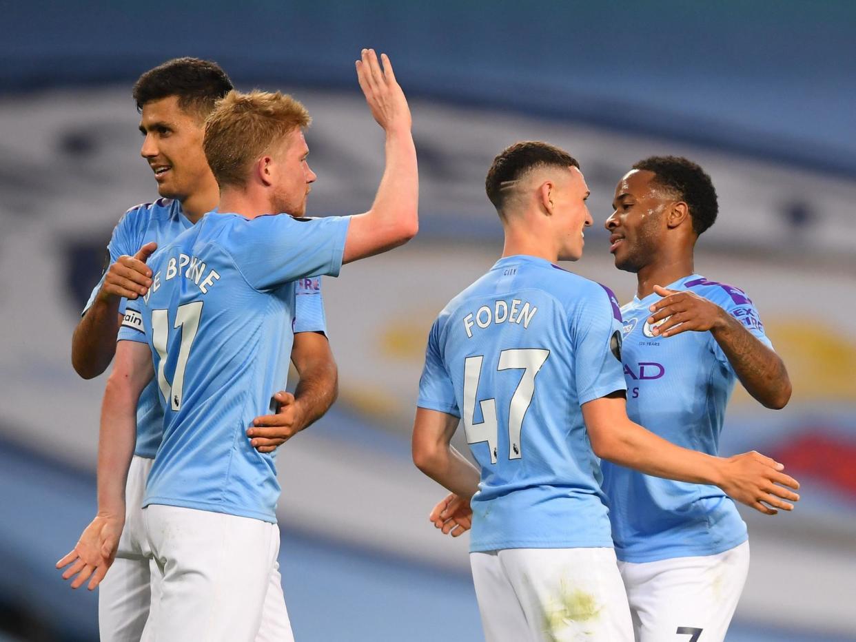 Raheem Sterling of Manchester City celebrates his sides fourth goal: Getty Images