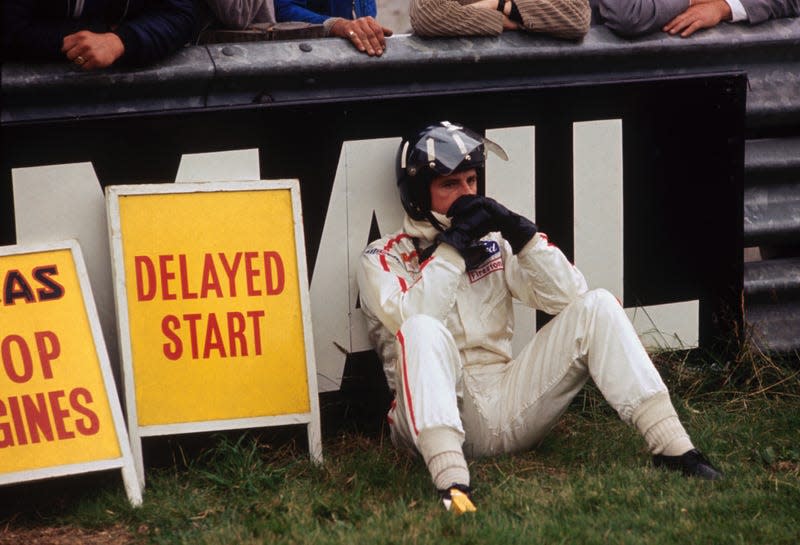 Formula 1 driver Graham Hill out of the 1968 British Grand Prix at Brands Hatch after his Lotus-Cosworth suffered a mechanical failure.