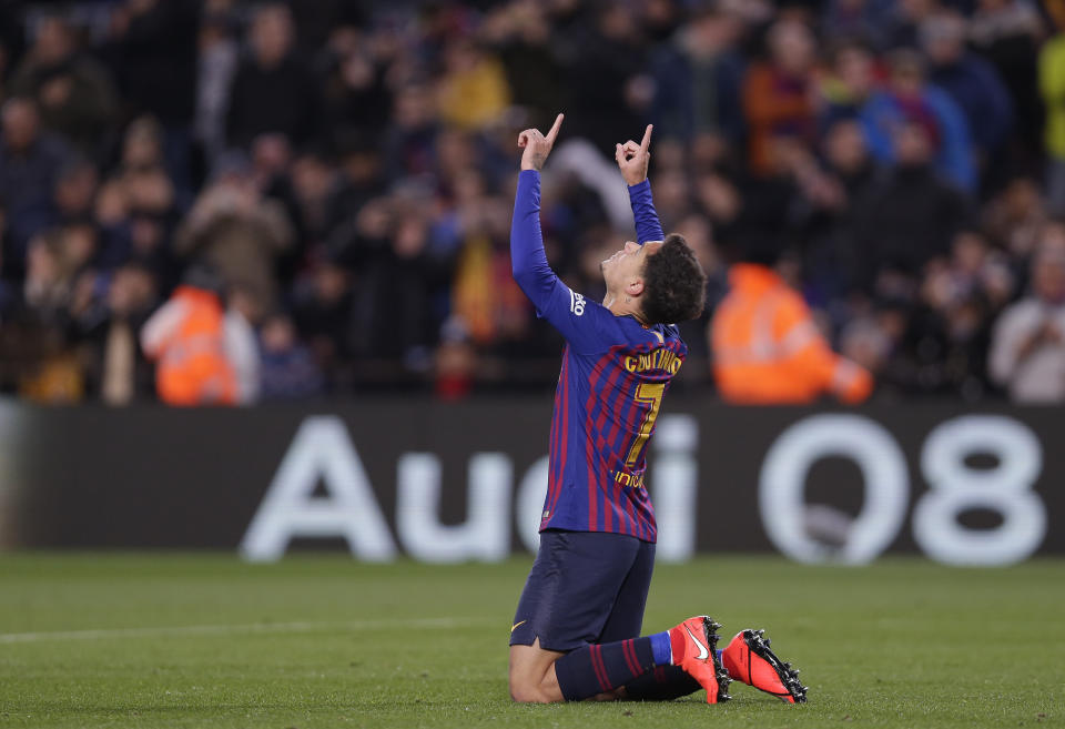 FC Barcelona's Coutinho celebrates after scoring during a Spanish Copa del Rey soccer match between FC Barcelona and Sevilla at the Camp Nou stadium in Barcelona, Spain, Wednesday, Jan. 30, 2019. (AP Photo/Manu Fernandez)