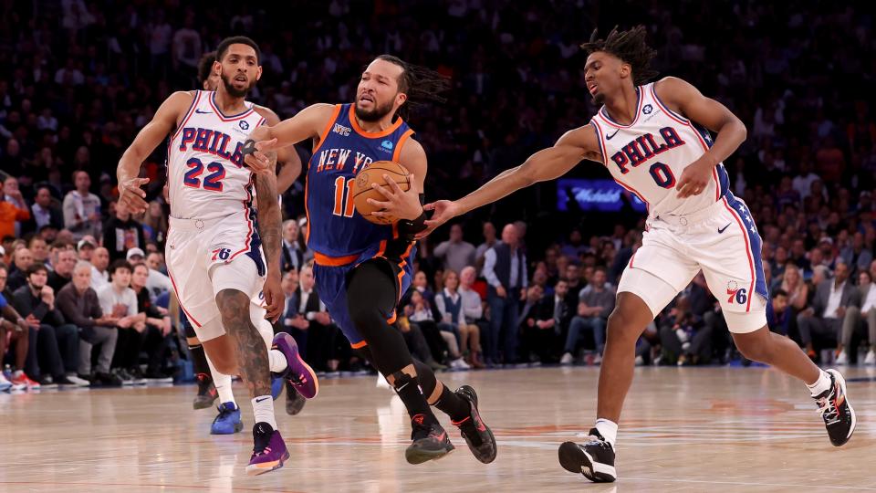 Apr 30, 2024; New York, New York, USA; New York Knicks guard Jalen Brunson (11) drives to the basket against Philadelphia 76ers guards Cameron Payne (22) and Tyrese Maxey (0) during the fourth quarter of game 5 of the first round of the 2024 NBA playoffs at Madison Square Garden. Mandatory Credit: Brad Penner-USA TODAY Sports