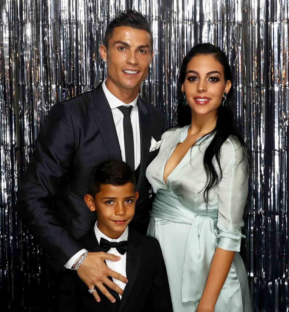 Cristiano Ronaldo, his girlfriend, Georgina Rodríguez and his son Cristiano Ronaldo Jr are pictured inside the photo booth prior to The Best FIFA Football Awards at The London Palladium on October 23, 2017 in London, England