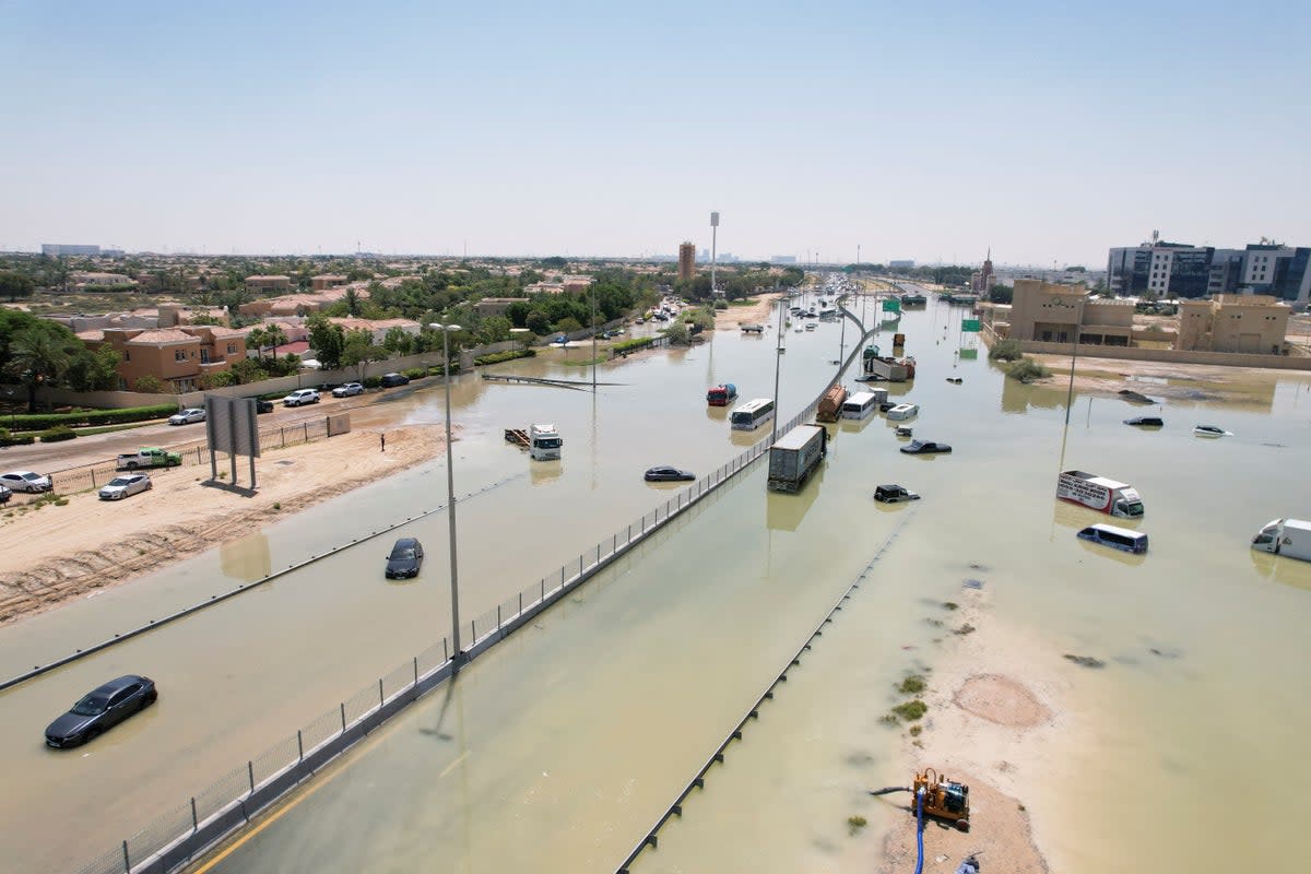 A drone view of cars and trucks lying partially submerged following heavy rainfall in Dubai (REUTERS)