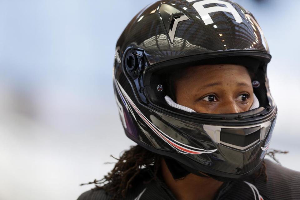 Lauryn Williams with the United States team, gets out of her sled after a training run for the two-man bobsled at the 2014 Winter Olympics, Thursday, Feb. 6, 2014, in Krasnaya Polyana, Russia. (AP Photo/Natacha Pisarenko)