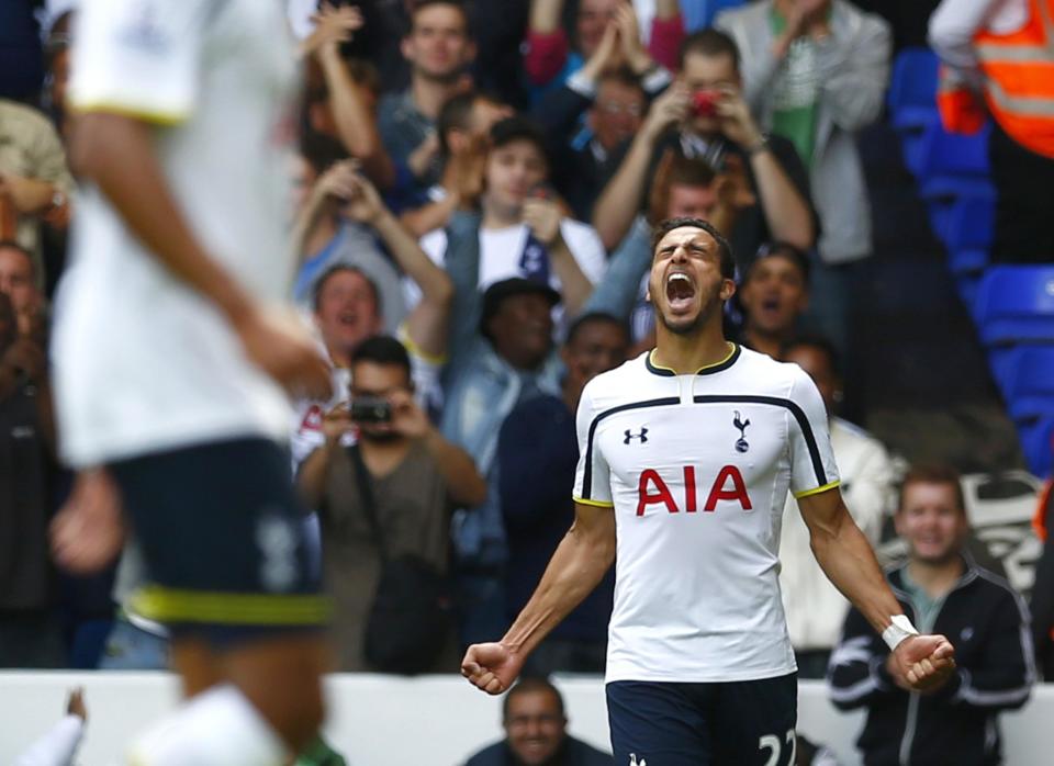 Tottenham Hotspur&#39;s Nacer Chadli (R) celebrates after scoring his second goal against Queens Park Rangers during their English Premier League soccer match at White Hart Lane in London August 24, 2014. REUTERS/Eddie keogh (BRITAIN - Tags: SPORT SOCCER) FOR EDITORIAL USE ONLY. NOT FOR SALE FOR MARKETING OR ADVERTISING CAMPAIGNS. NO USE WITH UNAUTHORIZED AUDIO, VIDEO, DATA, FIXTURE LISTS, CLUB/LEAGUE LOGOS OR &quot;LIVE&quot; SERVICES. ONLINE IN-MATCH USE LIMITED TO 45 IMAGES, NO VIDEO EMULATION. NO USE IN BETTING, GAMES OR SINGLE CLUB/LEAGUE/PLAYER PUBLICATIONS