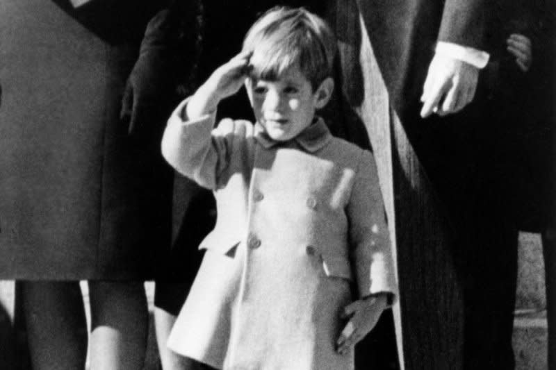 John F. Kennedy Jr. salutes as the casket of his father, President John F. Kennedy, is taken from St. Matthew's Cathedral to Arlington National Cemetery during funeral services on November 25, 1963. It was his third birthday. File Photo by Stan Stearns/UPI