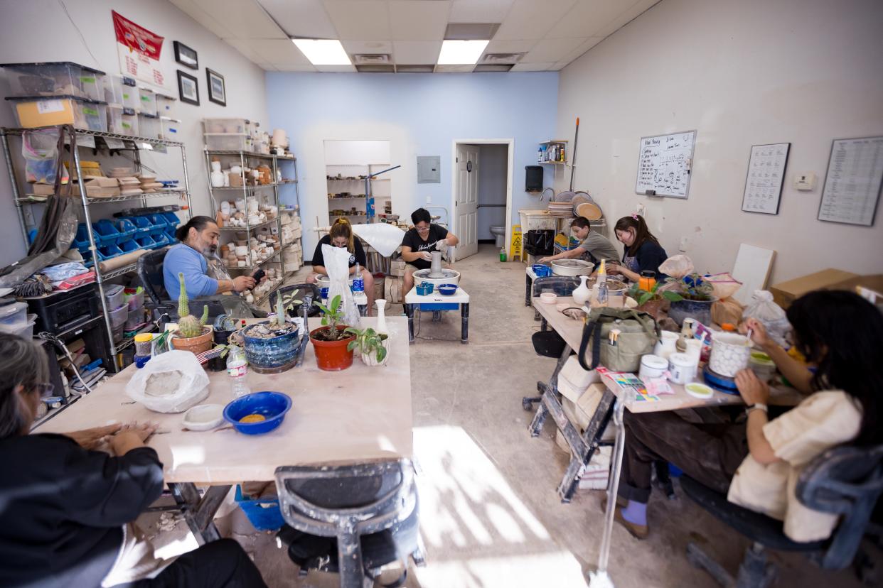 Philip John "PJ" Romero's students work on their pieces at his ceramics studio, PJ Romero Artworks, 120 S. Carolina Dr. in El Paso, TX, on Tuesday, June 18, 2024.