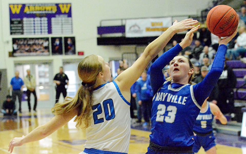 Mayville State's Jordan Zrust (23) shoots against Dakota State's Elsie Aslesen during the women's championship game of the North Star Athletic Association Basketball Final Four on Sunday, Feb. 26, 2023 in the Watertown Civic Arena.