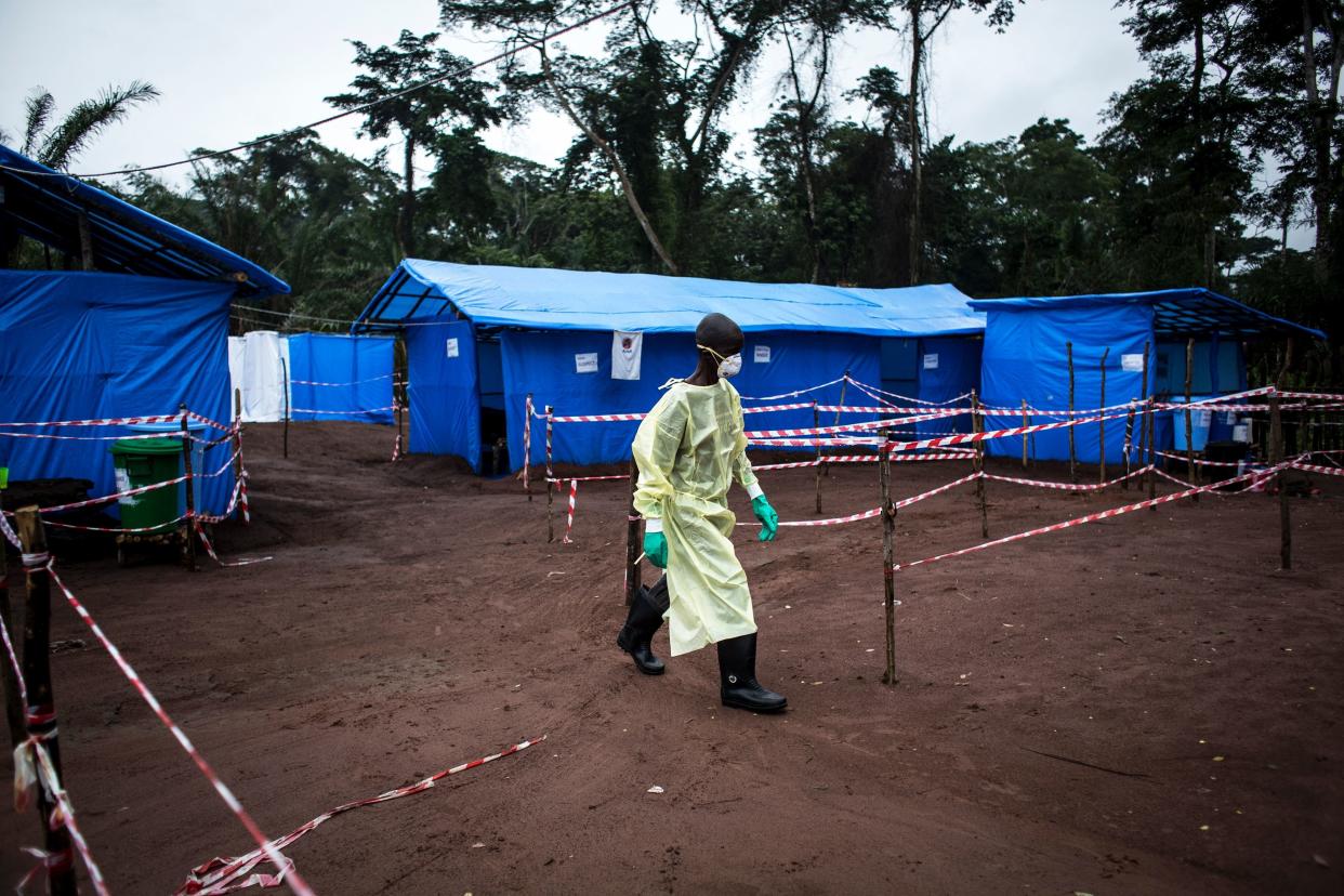 A health worker walks through an Ebola quarantine unit on June 13, 2017, in the village of Muma, after a case of Ebola was confirmed&nbsp;there. (Photo: JOHN WESSELS via Getty Images)