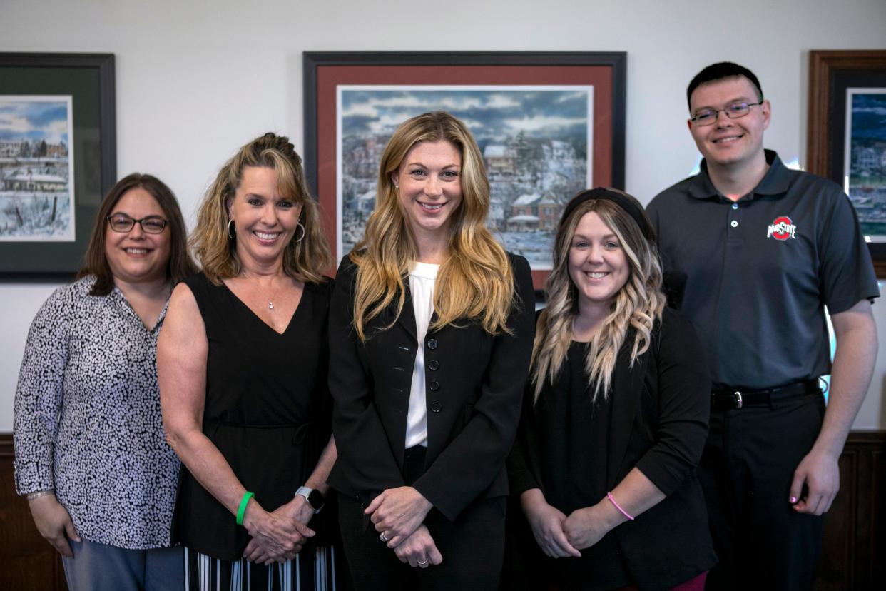 The staff at Sitterly Law stand inside of the conference room on April 29, 2024, in Lancaster, Ohio. Sitterly Law is the chamber of commerce small business winner.