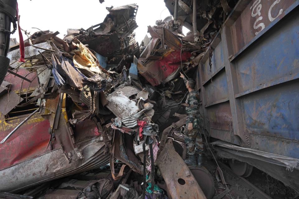 Rescuers work at the site of passenger trains that derailed in Balasore district, in the eastern Indian state of Orissa, Saturday, June 3, 2023. Rescuers are wading through piles of debris and wreckage to pull out bodies and free people after two passenger trains derailed in India, killing more than 280 people and injuring hundreds as rail cars were flipped over and mangled in one of the country’s deadliest train crashes in decades. (AP Photo/Rafiq Maqbool)