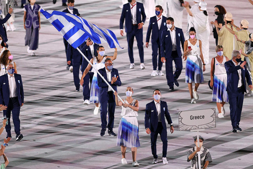 <p>While the men's uniforms were pretty basic, the women in Greek's delegation wore super-chic pleated skirts. </p>