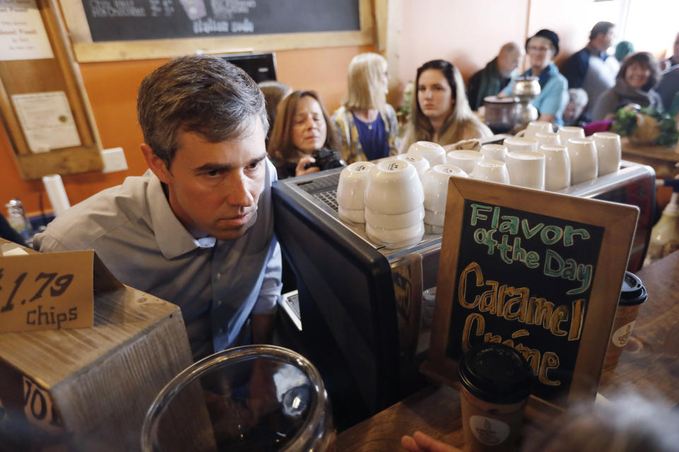 Former Texas congressman Beto O'Rourke talks with an audience member during a stop at the Central Park Coffee Company, Friday, March 15, 2019, in Mount Pleasant, Iowa. O'Rourke announced Thursday that he'll seek the 2020 Democratic presidential nomination. (AP Photo/Charlie Neibergall)