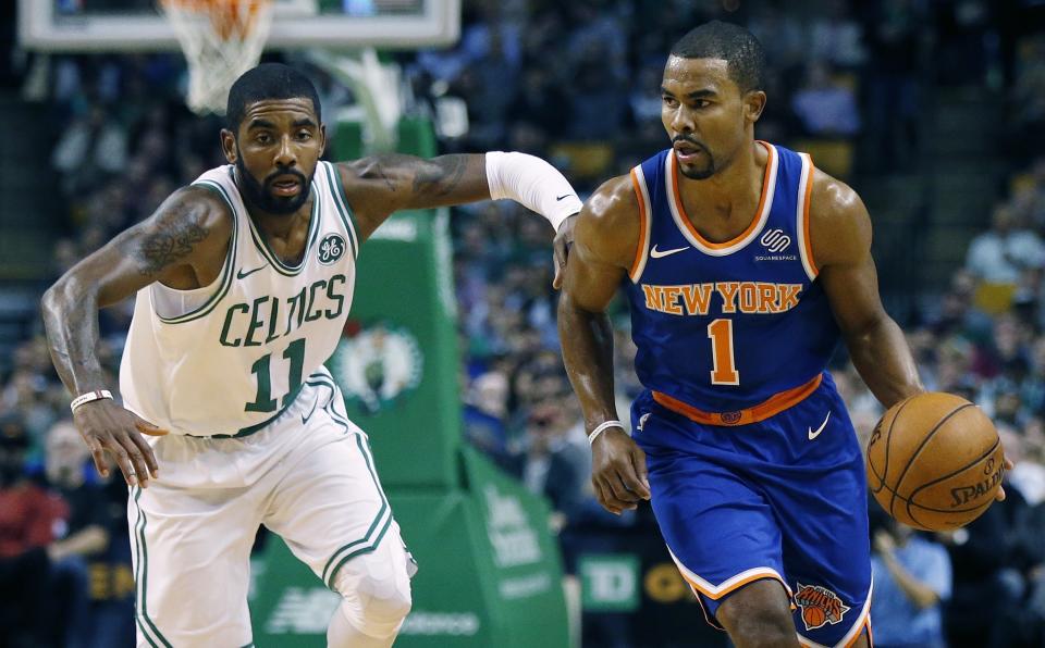 Ramon Sessions brings the ball up the court against the Celtics’ Kyrie Irving in an October game. (AP)