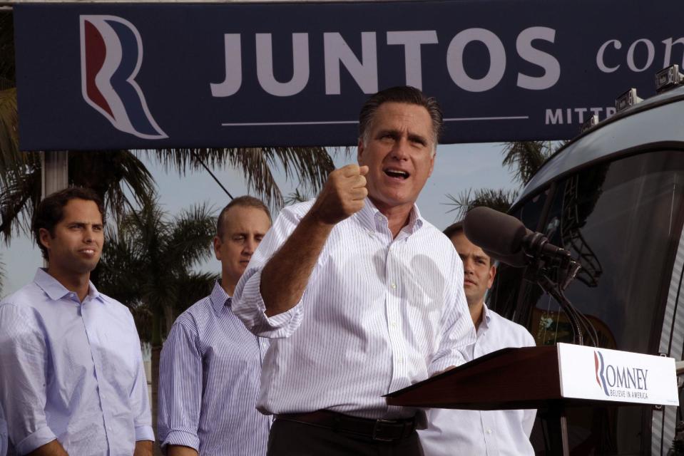 FILE - In a Monday, Aug. 13, 2012 file photo, Republican presidential candidate, former Massachusetts Gov. Mitt Romney, speaks at a campaign event in Miami. Behind him, from left are, his son Craig, Rep. Mario Diaz-Balart, R-Fla., and Sen. Marco Rubio, R-Fla. Florida's economy is center stage in President Barack Obama and Romney's high-stakes campaign for the rich trove of 29 electoral votes. One of the biggest prizes still up for grabs, this state, a hard-fought White House battleground in 2000, could be just as pivotal this year. (AP Photo/Mary Altaffer, File)