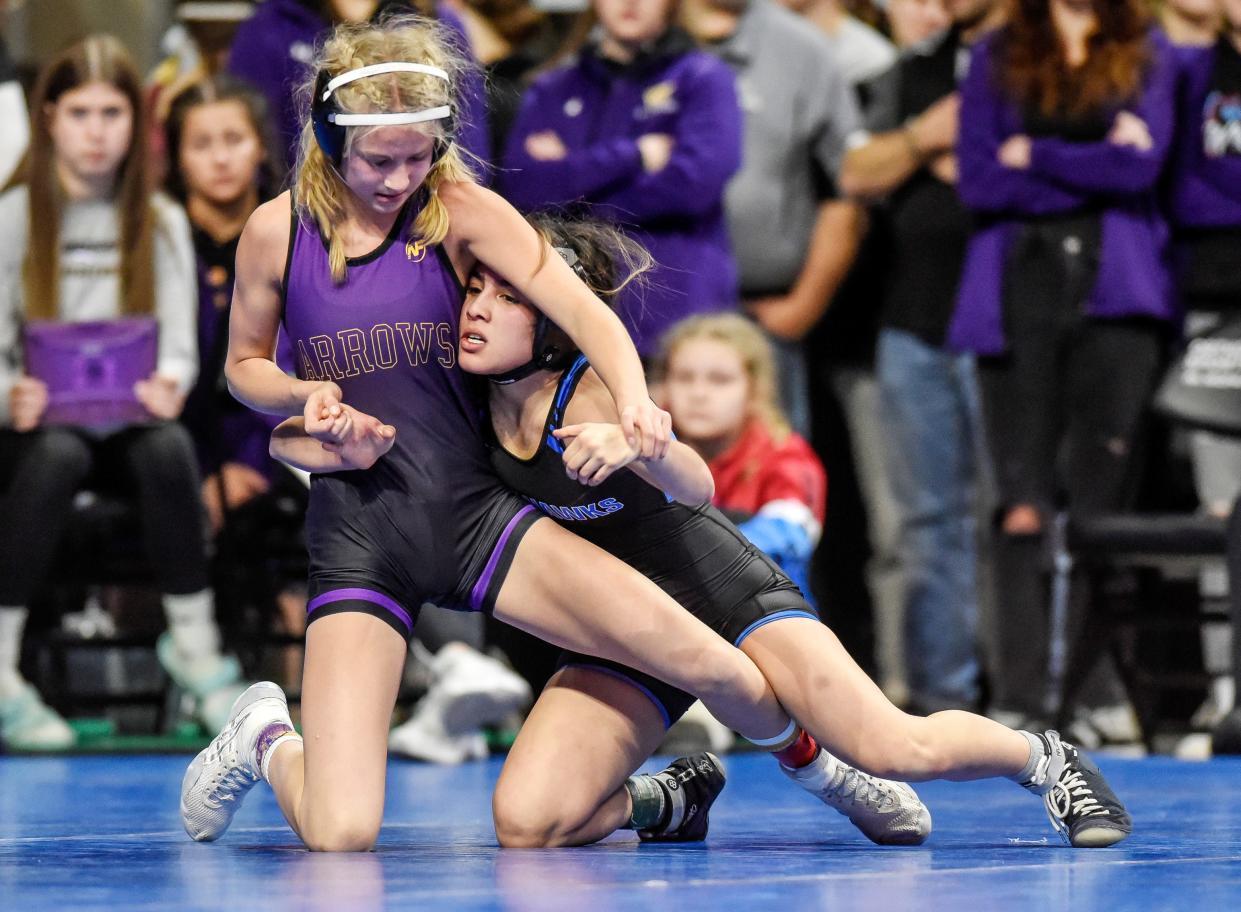 Watertown's Olivia Anderson, left, wrestles Hettinger/Scranton's Jennifer Verdin in the girls 100-pound championship match the Rapid City Invitational on Saturday, Dec. 9, 2023 at Summit Arena at The Monument.