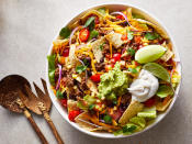 <p>A super-quick blend of reduced-fat sour cream and salsa serves double duty as salad dressing and seasoning for the meat in our updated version of Tex-Mex taco salad. Depending on the type of salsa you use, the salad will vary in heat. We keep this version light with lean turkey, but lean ground beef (about 95%-lean) would also keep the nutrition marks reasonable. Just hold the deep-fried tortilla bowl and instead serve this salad with baked tortilla chips and wedges of fresh lime. <a href="https://www.eatingwell.com/recipe/249157/taco-salad/" rel="nofollow noopener" target="_blank" data-ylk="slk:View Recipe;elm:context_link;itc:0;sec:content-canvas" class="link ">View Recipe</a></p>