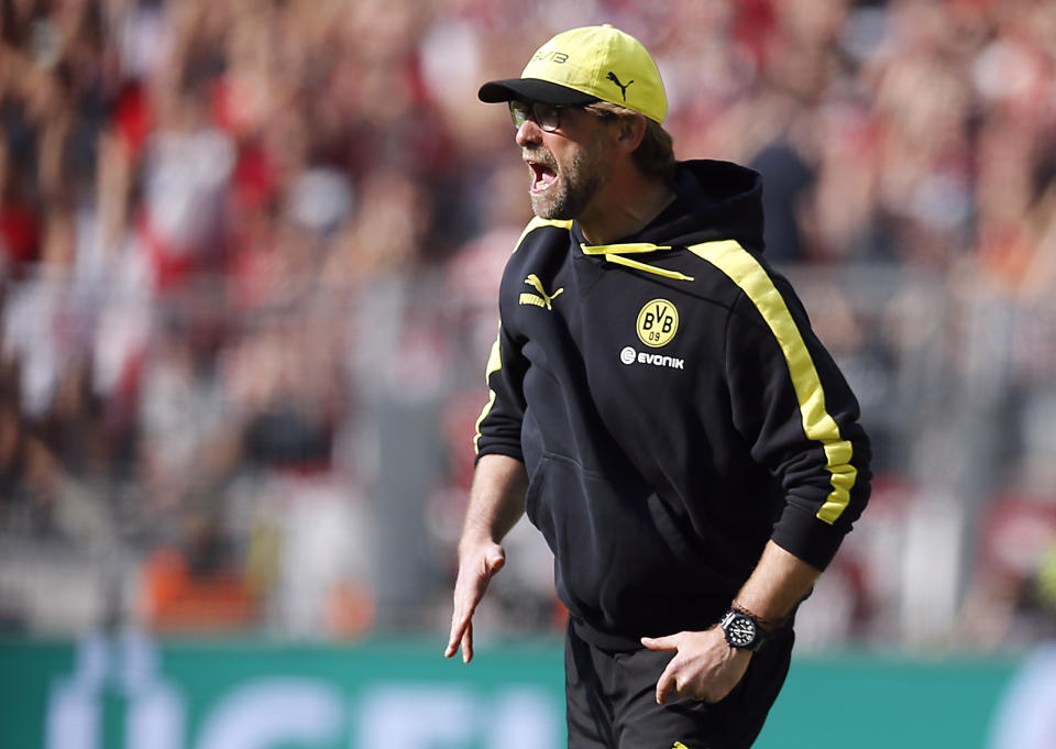 Dortmund head coach Juergen Klopp shouts during the German first division Bundesliga soccer match between BvB Borussia Dortmund and Mainz 05 in Dortmund, Germany, Saturday, April 19, 2014. (AP Photo/Frank Augstein)