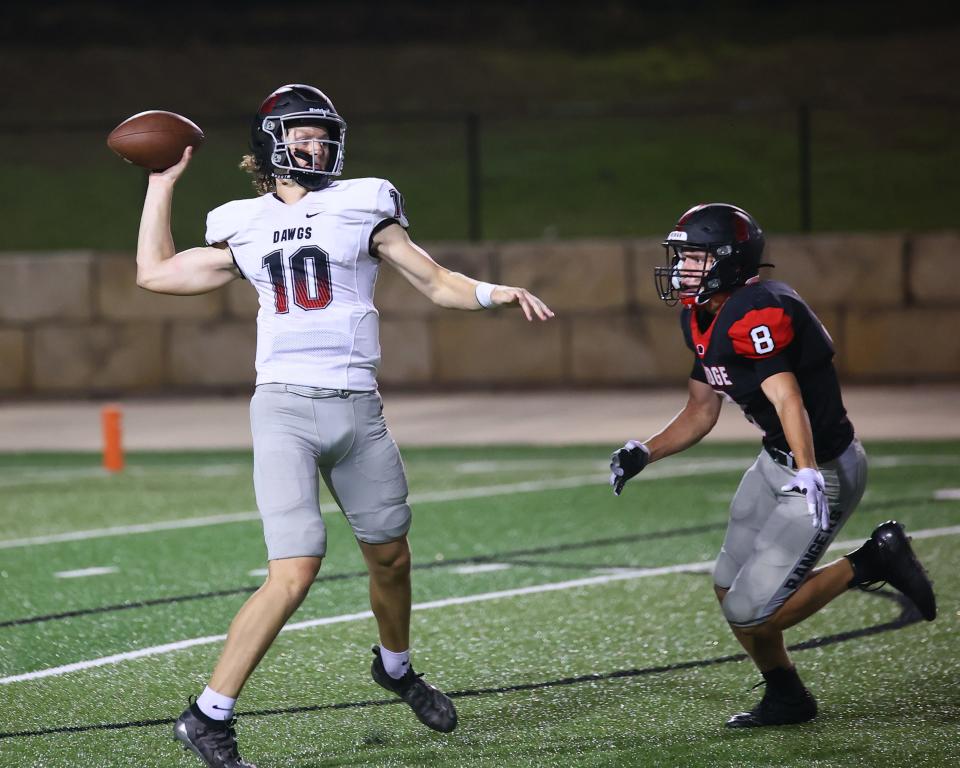 Connor Kenyon, 10, slings a pass in relief of Diego Tello for Bowie against Vista Ridge in the second half Aug. 27 at Gupton Stadium. The Bulldogs won 17-7 over the Rangers in the season opener for both teams. 