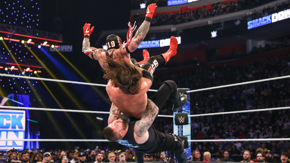 Kevin Owens gives a German Suplex to AJ Styles and Rey Mysterio during Friday Night Smackdown at Little Caesars Arena on April 12, 2024 in Detroit, Michigan.