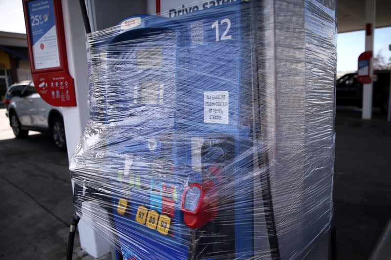 A gas pump is seen wrapped in plastic as Hurricane Sally approaches in Bay St. Louis