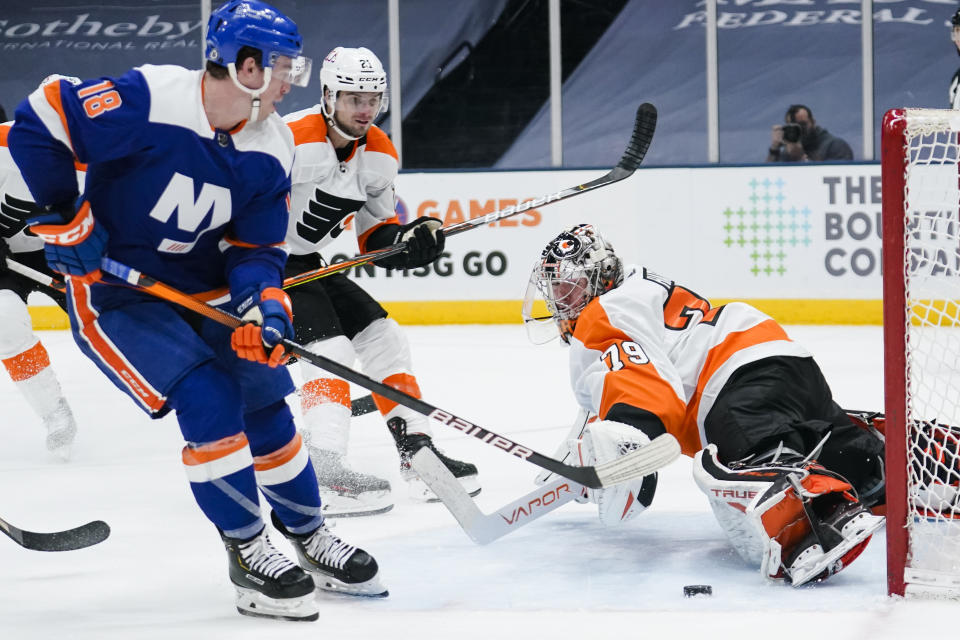 Philadelphia Flyers goaltender Carter Hart (79) stops a shot on goal by New York Islanders' Anthony Beauvillier (18) during the second period of an NHL hockey game Thursday, April 8, 2021, in Uniondale, N.Y. (AP Photo/Frank Franklin II)