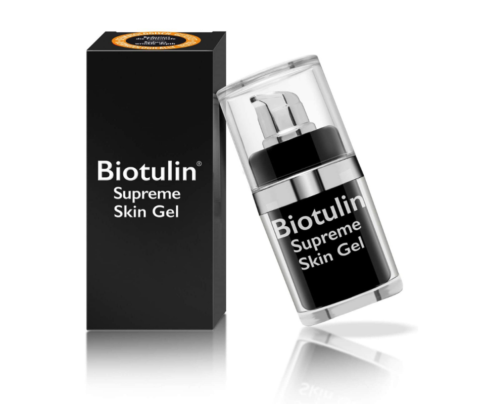 Against a white background, a black cardboard packaging box of Biotulin stands with the bottle with a clear lid on the right. 