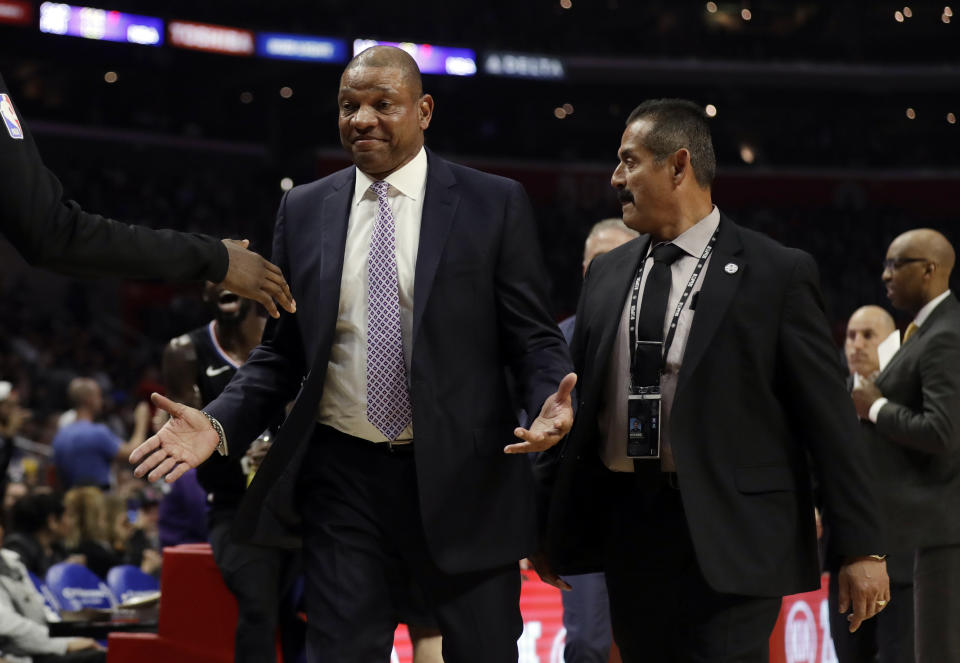 Los Angeles Clippers head coach Doc Rivers is escorted off the court after being ejected from an NBA basketball game against the Chicago Bulls Friday, March 15, 2019, in Los Angeles. (AP Photo/Marcio Jose Sanchez)