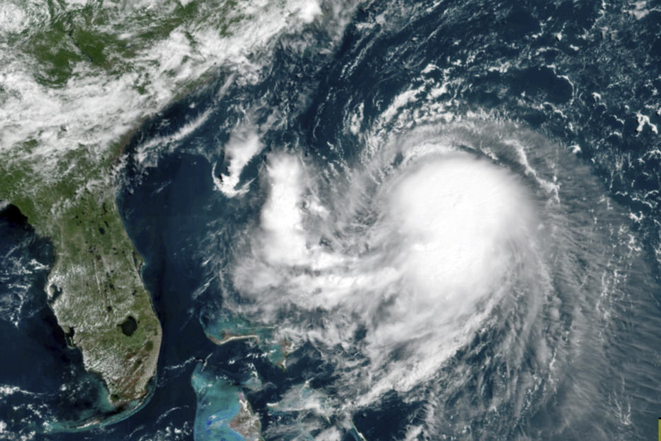 This OES-16 East GeoColor satellite image taken Friday, Aug. 20, 2021, at 11:40 a.m. EDT., and provided by NOAA, shows Tropical Storm Henri in the Atlantic Ocean. Henri was expected to intensify into a hurricane by Saturday, the U.S. National Hurricane Center said. Impacts could be felt in New England states by Sunday, including on Cape Cod, which is teeming with tens of thousands of summer tourists. (NOAA via AP)