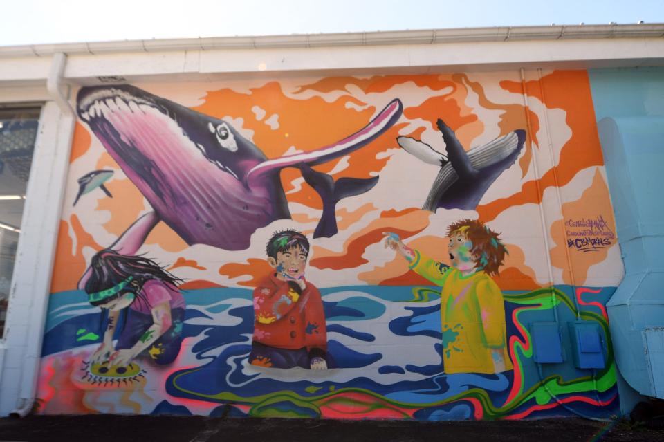 The "Fingerpainting" mural at 915 N. Lake Park Blvd. is one of the numerous murals throughout Carolina Beach.     [MATT BORN/STARNEWS]