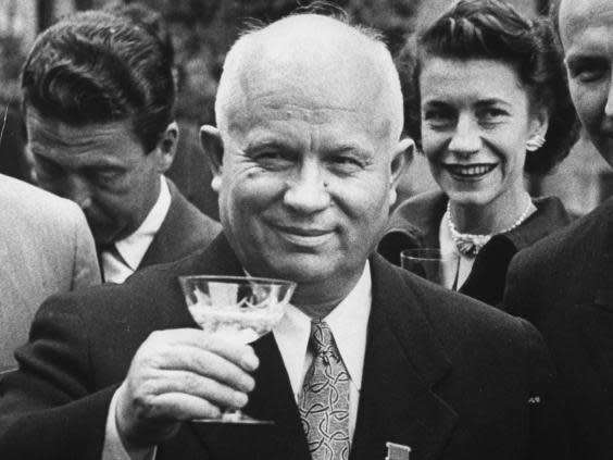 (Getty) Nikita Khrushchev, brandishing a glass rather than a shoe
