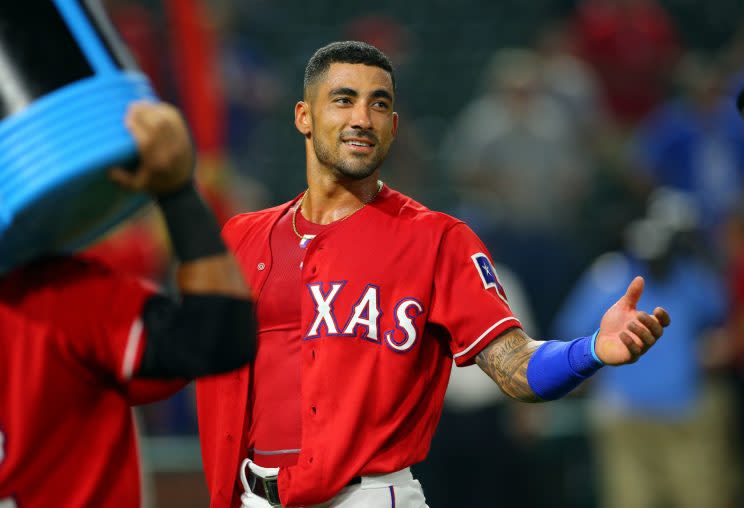 Ian Desmond played the hero for the Rangers on Monday. (Getty Images/Rick Yeatts)