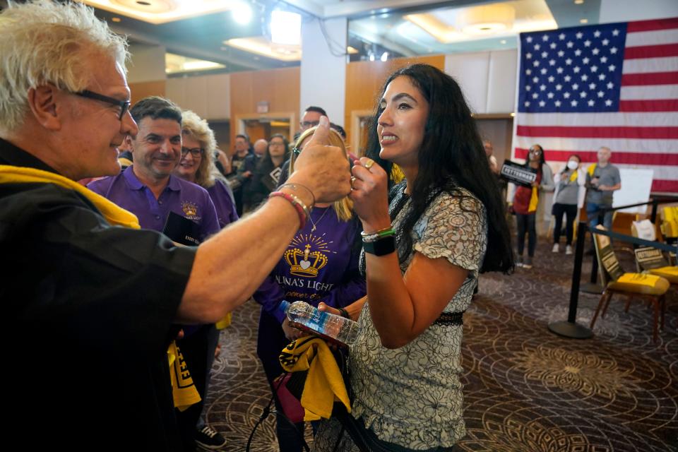 Gisele Barreto Fetterman, the wife of Pennsylvania Lt. Governor John Fetterman, who is the projected Democratic nominee for the U.S. Senate for Pennsylvania, right, greets supporters at a hotel in Imperial, Pa., to watch election returns Tuesday, May 17, 2022.