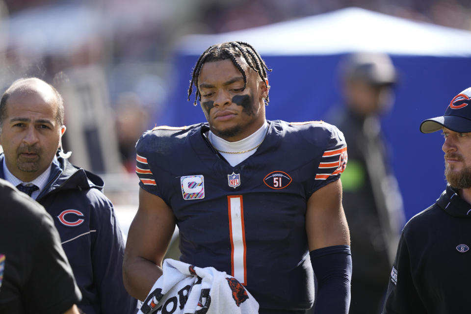 Chicago Bears quarterback Justin Fields walks to the locker room after being sacked during the second half of an NFL football game against the Minnesota Vikings, Sunday, Oct. 15, 2023, in Chicago. (AP Photo/Charles Rex Arbogast)