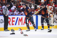 Edmonton Oilers' Connor McDavid (97) celebrates his hat trick against the Calgary Flames, during the third period of an NHL hockey game Saturday, Oct. 16, 2021, in Edmonton, Alberta. (Jason Franson/The Canadian Press via AP)