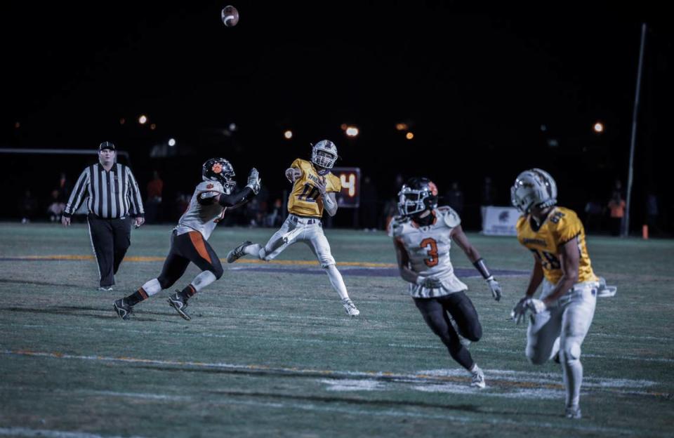 Sayre quarterback Luke Pennington finds Grant Barnsten for a touchdown late in the third quarter, his fifth TD pass of the night, as the Spartans defeated visiting Paris.