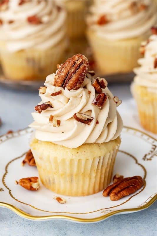 <p>Pizzazzerie</p><p>Made with a delicious butter pecan cupcake full of toasted pecans and topped with brown sugar cream cheese frosting.</p><p><strong>Get the recipe: </strong><a href="https://pizzazzerie.com/recipes/pecan-pie-cupcakes/" rel="nofollow noopener" target="_blank" data-ylk="slk:Pecan Pie Cupcakes;elm:context_link;itc:0;sec:content-canvas" class="link rapid-noclick-resp"><strong>Pecan Pie Cupcakes</strong></a></p>