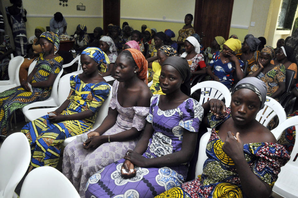 FILE - Chibok schoolgirls freed from Boko Haram captivity are seen in Abuja, Nigeria, Sunday May 7, 2017. Seven years after Boko Haram extremists abducted more than 270 schoolgirls in northeast Nigeria, two of the more than 100 still being held by the rebels returned this month, renewing the hope of parents who have all but given up on the long wait for the return of their children. Some of the affected parents said they remain hopeful that they will reunite with their children in Borno State, where the Boko Haram insurgency has lasted for more than a decade. (AP Photo/ Olamikan Gbemiga, File)