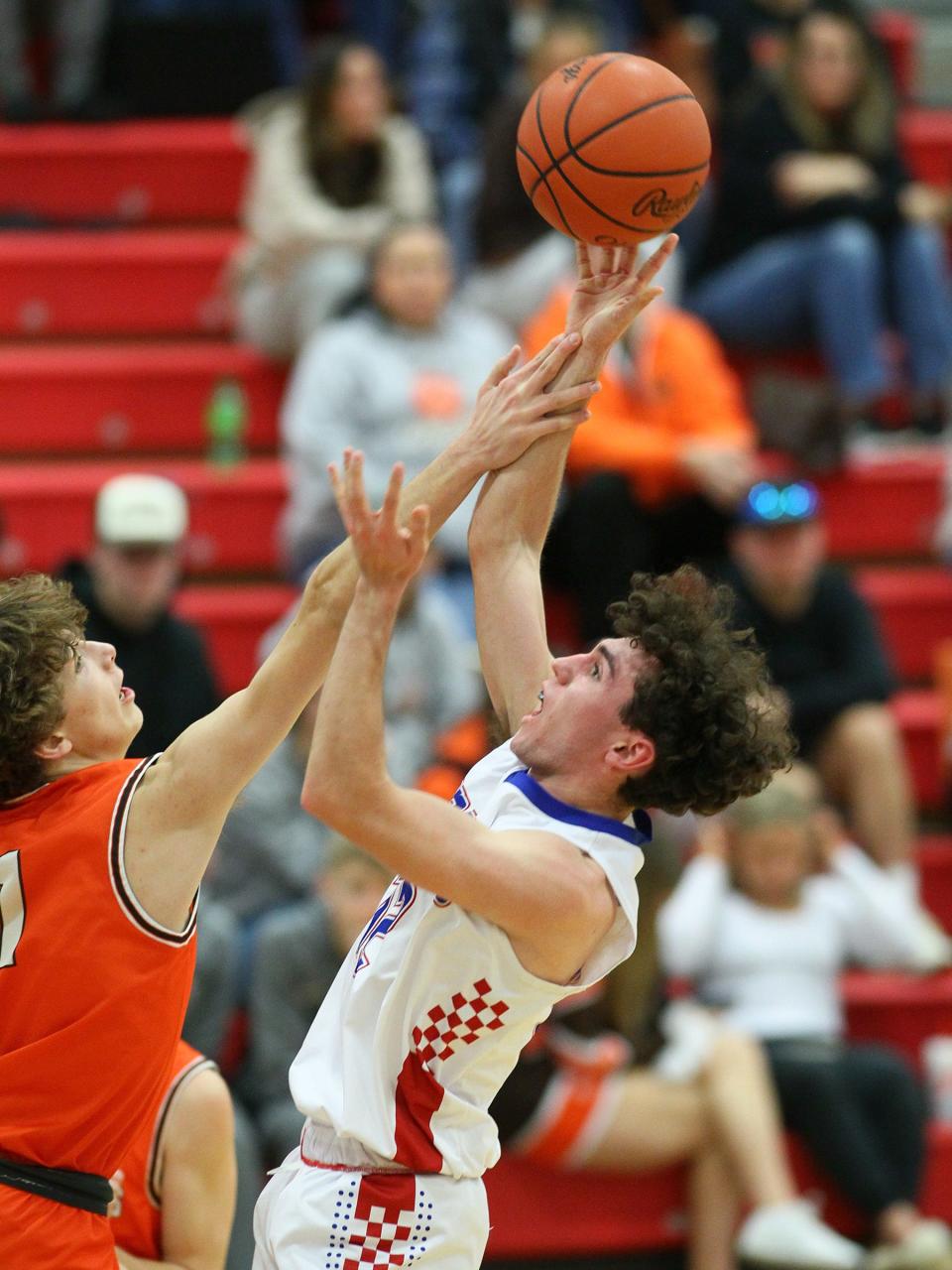 Heath's Jaxon Duston defends Lakewood's Colton Ferry on Friday.